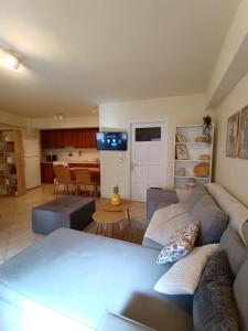 a living room with a couch and a table at Nafplio Nook 2 in Nafplio +11 photos