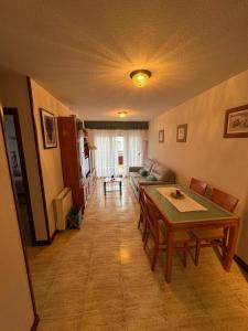 a living room with a table and a couch at Apartamento La Ojerada in Ajo
