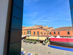 a view of a town from a window of a building at Cà De La Corona EXPERIENCE in Chioggia