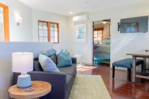 a living room with a couch and a table at The Little Pumpkin Guest House in San Diego