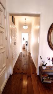 a hallway of a home with a hard wood floor at DockApartment in Vila Nova de Gaia