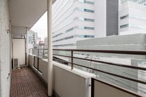 a balcony with a view of a building at NIYS apartments 56type in Tokyo
