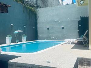 Foto de Casa Completa com Piscina e Conforto no Centro