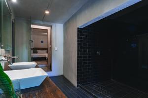 a bathroom with a white sink and a mirror at Casa Xaca in San Miguel de Allende +142 photos