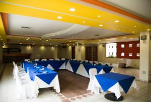 a banquet hall with blue and white tables and chairs at Hotel La Loma Tepic in Tepic +57 photos