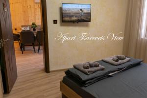 a room with a bed with two pillows on it at Apart Tsarevets View - Free PARKING in Veliko Tŭrnovo