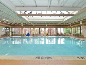 a swimming pool with a no swimming sign in a building at DoubleTree by Hilton Wilkes-Barre in Wilkes-Barre