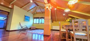 a living room with a table and a dining room at La Casona y El Apartamento De La Foz in Lugar de Arriba