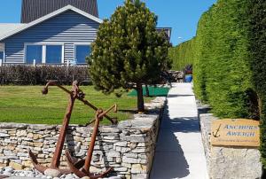a statue of antlers next to a stone wall at Anchors Aweigh in Stanley