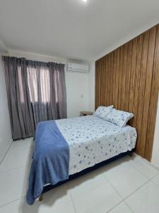 a bedroom with a bed and a large window at Tulipanes 901 in Ciudad del Este +45 photos