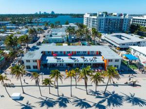 an aerial view of a resort on the beach with palm trees at La Terrace Oceanfront in Hollywood