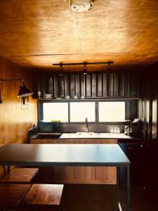 a kitchen with a sink and a counter top at Nomada Republic Hotel El valle in Valle de Anton