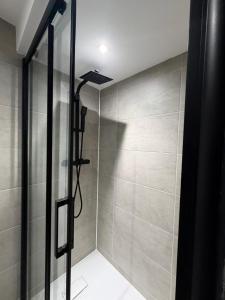 a shower with a glass door in a bathroom at Premium Apartment with Dover Castle Views, Central Dover in Dover +7 photos