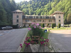 a large building with flowers on the side of a road at Bright airy spacious apartment in Passy