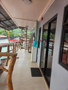 a boat deck with chairs and stairs on a boat at Aloha Aina Dive Resort in Mabini +18 photos