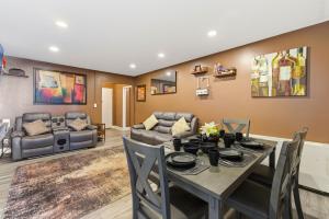 a living room with a table and a couch at Beautiful 3BR Condo in DTWN Pool Access in Atlanta