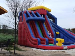 a large inflatable water slide at a park at Perła Brenno in Brenno