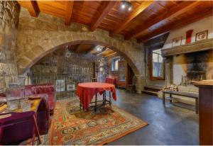 a room with a table with a red cloth on it at Parco del Paradosso in Viterbo