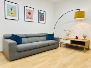 a living room with a couch and a table at Casa Genzino in Molfetta
