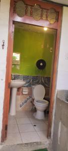 a bathroom with a toilet and a sink at Casa de Juanita in Cajamarca