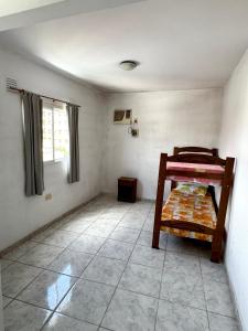 a small room with a bunk bed in it at Departamento Centrico 2B in Gualeguaychú