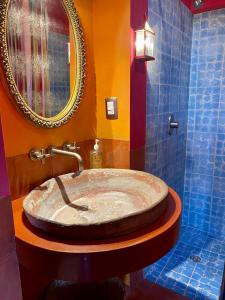 a bathroom with a large sink and a mirror at Posada de la cruz #4 in Querétaro +13 photos