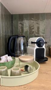 a tray of kitchen items sitting on a counter at Casa Verde in Saint-Chamond