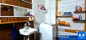 a bathroom with a sink and a washing machine at Casa Del Chef Lupita in Campeche +46 photos