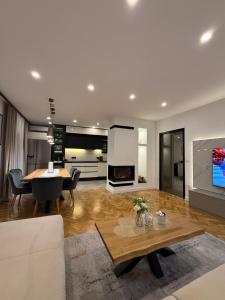 a living room with a couch and a table at Residence Stina in Široki Brijeg