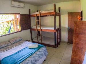 a bedroom with two bunk beds in a room at The Beach Hostel Milagres in São Miguel dos Milagres +54 photos