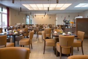 a dining room filled with tables and chairs at Trip Inn Goethe Hotel Messe Frankfurt in Frankfurt