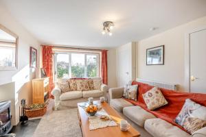 a living room with a couch and a table at 2 Bed in Duns oc-c34024 in Duns