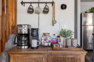 a counter with a coffee maker on top of it at Cozy Chalet in the Pines in Munds Park