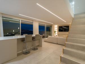 a living room with a bar and a couch at Salobre Golf Villas Kaiman in Salobre