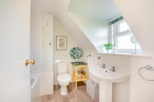 a white bathroom with a toilet and a sink at 2 Bed in Duns oc-c34024 in Duns +29 photos