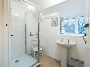 a bathroom with a glass shower and a sink at 4 Bed in Lower Bockhampton oc-t34129 in West Stafford +14 photos