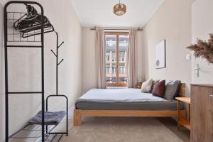 a bedroom with a bed and a shelf at Bistro Walk Apartment in Lausanne