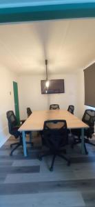 a conference room with a large table and chairs at Hotel Huasco in Huasco