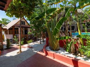 a resort with a lot of trees and a pool at Las Barracas de la Barra in Malucano