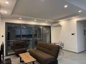 a living room with a couch and a table at 3 bed flat in Nicosia in Nicosia