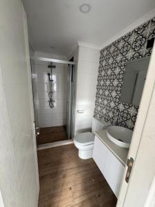 a bathroom with a toilet and a sink at 3 bed flat in Nicosia in Nicosia