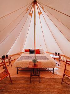 a room with a bed in a tent at Olympic Glamping in Port Angeles