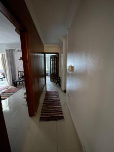 a hallway with rugs on the floor of a house at Cozy Private Room with Jacuzzi Maadi in Cairo