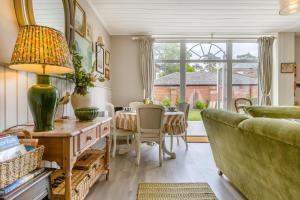 a living room with a couch and a table at 2 Bed in Tunstead oc-o32203 in Tunstead