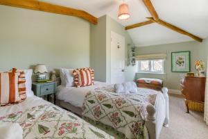 a bedroom with two beds and a window at 2 Bed in Tunstead oc-o32203 in Tunstead