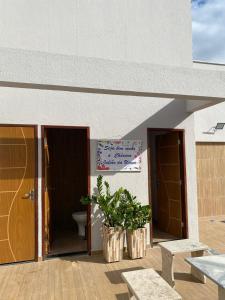 a building with a toilet and a sign on it at Chácara Julião da usina in Juazeiro do Norte