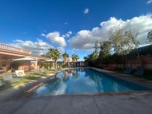 a swimming pool in the middle of a street at Private pool villa & garden Marrakech in Marrakesh