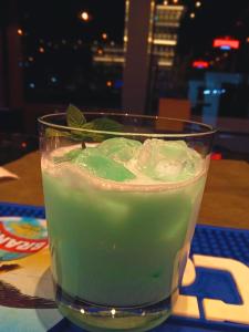 a green drink in a glass sitting on a table at primitivo complejo in Comandante Luis Piedra Buena +7 photos
