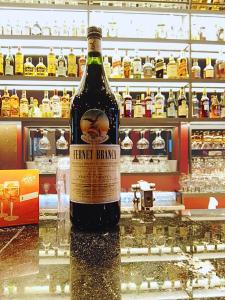 a bottle of wine sitting on a counter in a store at primitivo complejo in Comandante Luis Piedra Buena