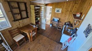 an overhead view of a room with a table and a refrigerator at Casa ceu in Florianópolis +5 photos